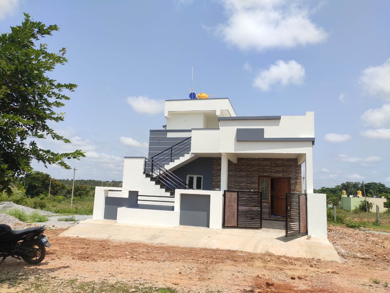 Completed duplex house on a 30x45 site in Bengaluru with external staircase