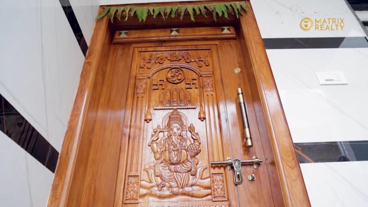 Carved main door of a Bengaluru home