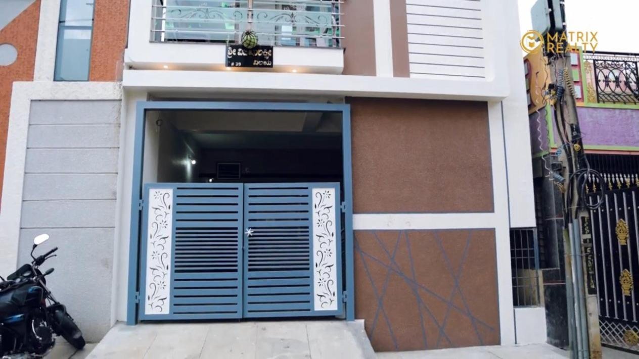 Compound wall and entrance gate of a house built by Matrix Realty