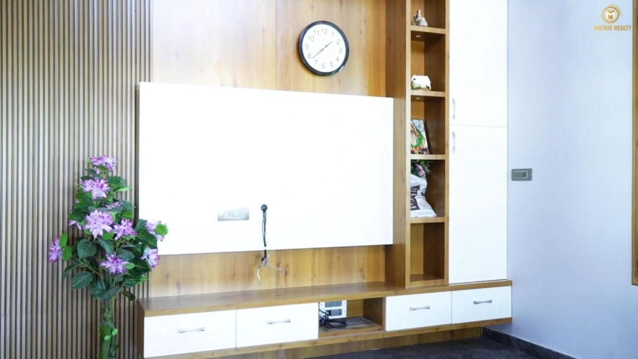 Living hall with TV unit in a duplex built by Matrix Realty